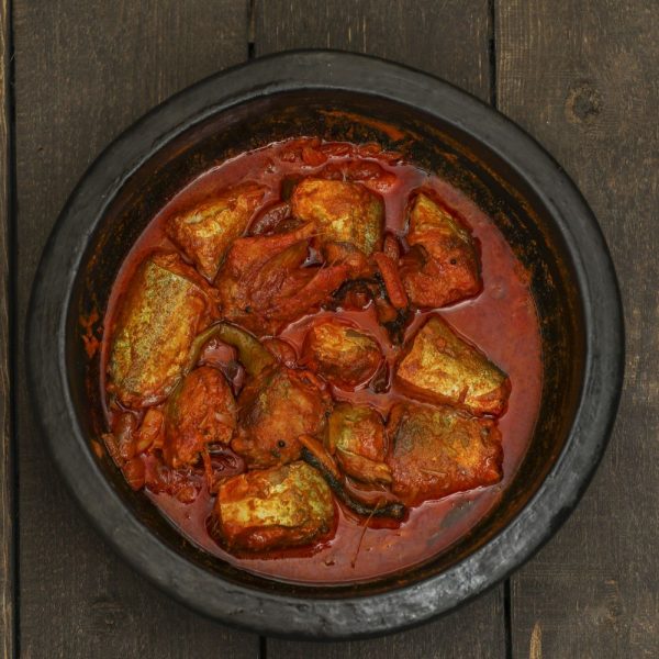 Ayala Curry in a clay pot on a wooden table