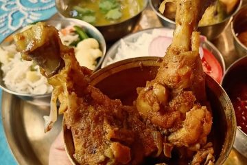 Chicken Kasha along with other dishes in a thali