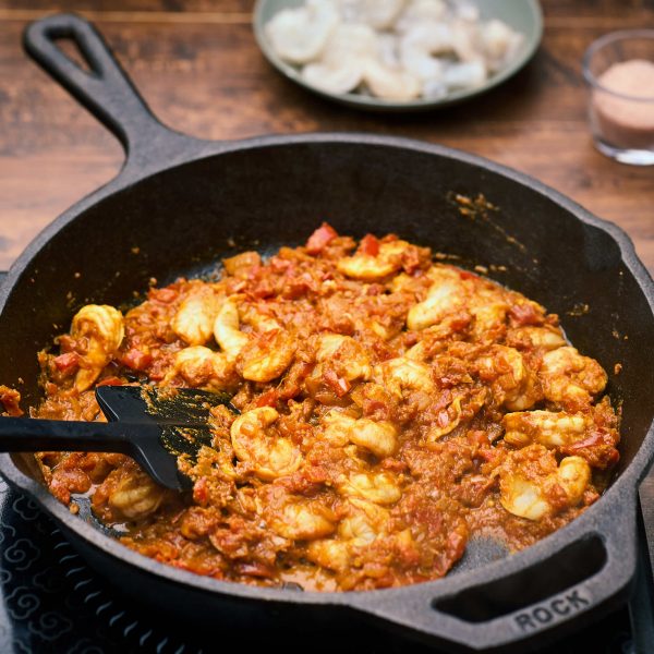 frying the prawns in the patio masala