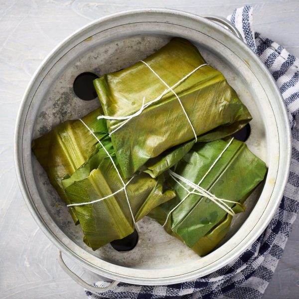 Pomfret wrapped in banana leaves and steamed to make patrani macchi