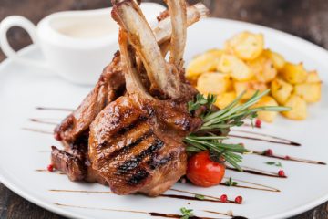 Lamb chops on a white plate