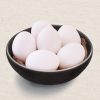 6 Classic white Eggs in a black bowl.