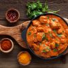 Amritsari Chicken masala on a wooden plate