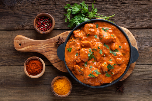 Amritsari Chicken masala on a wooden plate