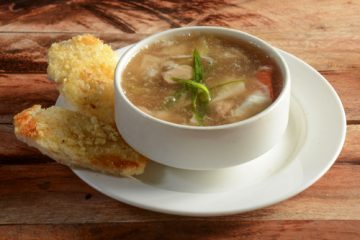 Chicken,Talumein Soup in a white soup bowl