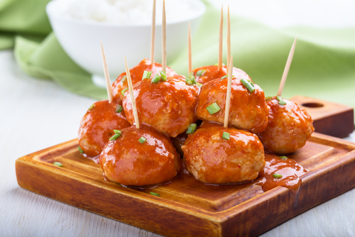Chicken,Meatballs,On,Skewers,Served,With,Rice,,Easy,Appetizer Chicken Meatballs on a wooden tray